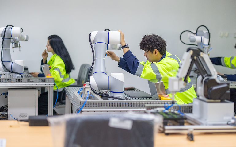 Technology professionals working with robotics